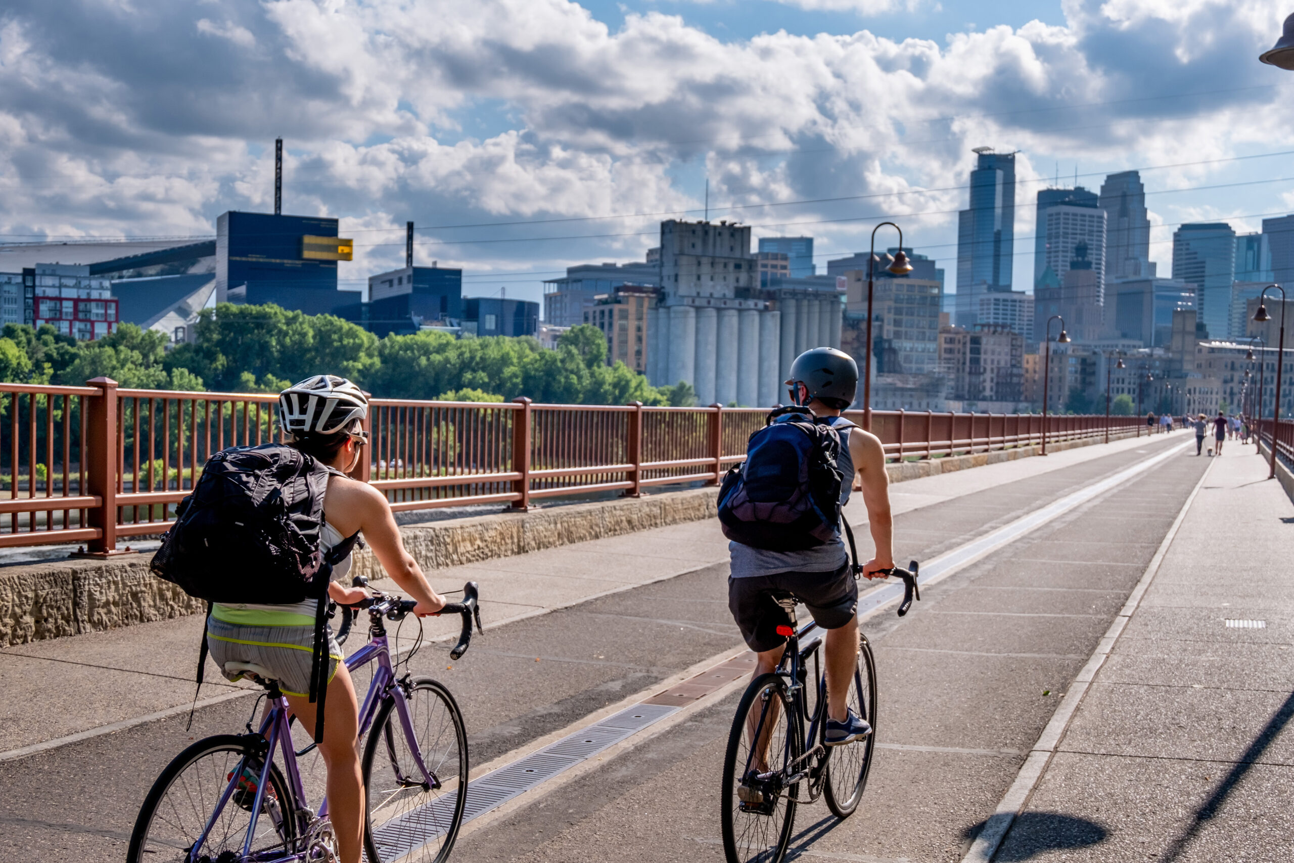 Cyclists by the Mississippi River